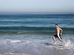 man running on beach picture